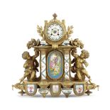 A late 19th century French gilt bronze and S&#232;vres style inset porcelain figural mantel clock...