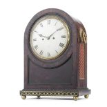 A first half of the 19th century brass inlaid and mounted mahogany table clock