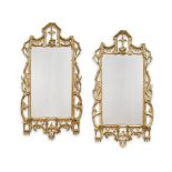 A pair of late 19th/early 20th century carved giltwood mirrors in the George III style (2)