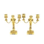 Henri Dasson (French, 1825-1896): A pair of late 19th century gilt bronze dwarf figural candelabr...