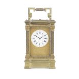 A late 19th century French gilt brass carriage clock with repeat the movement stamped RC for Rich...
