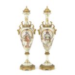 A pair of early 20th century French gilt bronze mounted Sevres style porcelain garniture vases i...