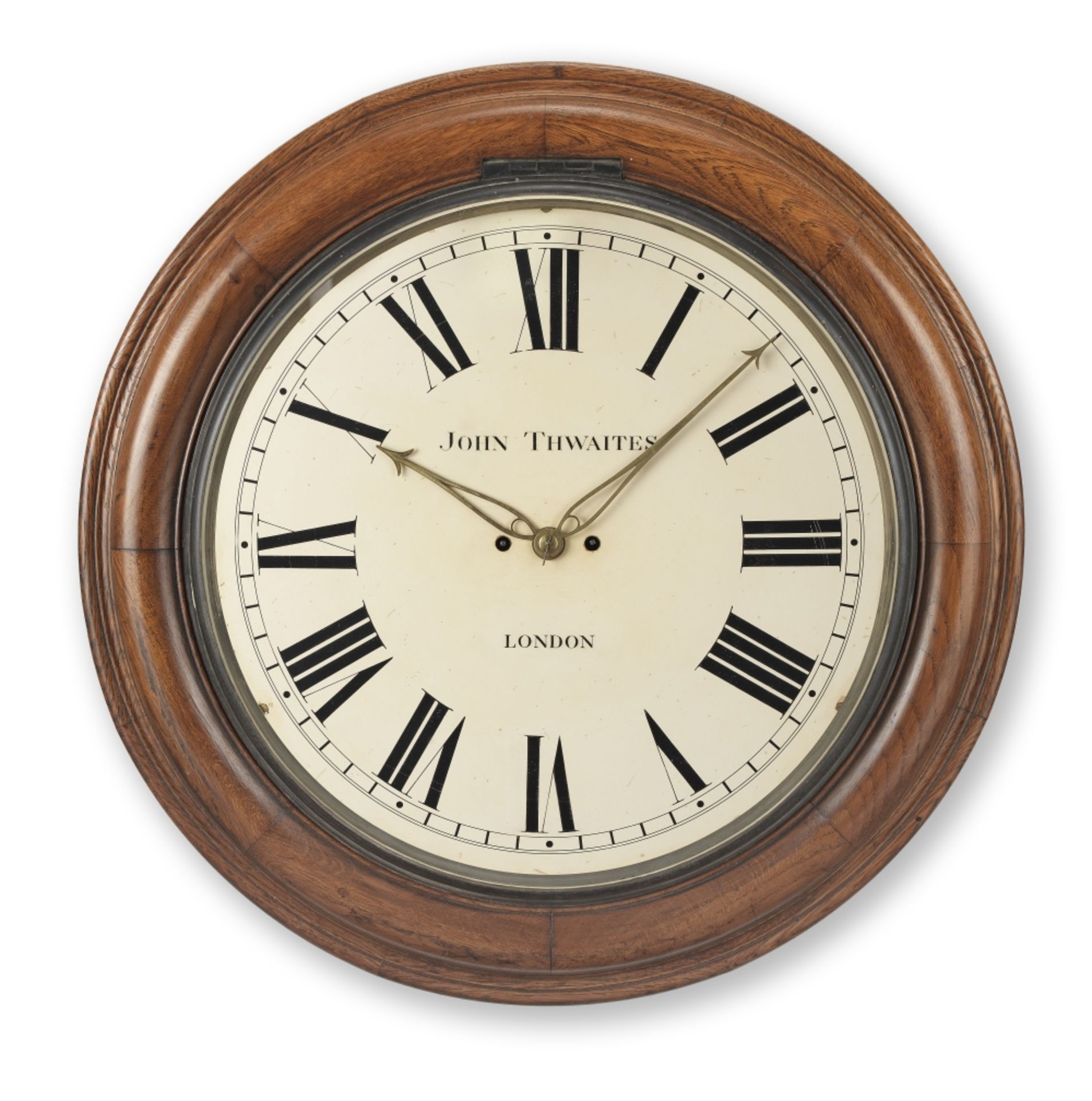 A large late 19th century oak striking wall clock the dial signed John Thwaites, London