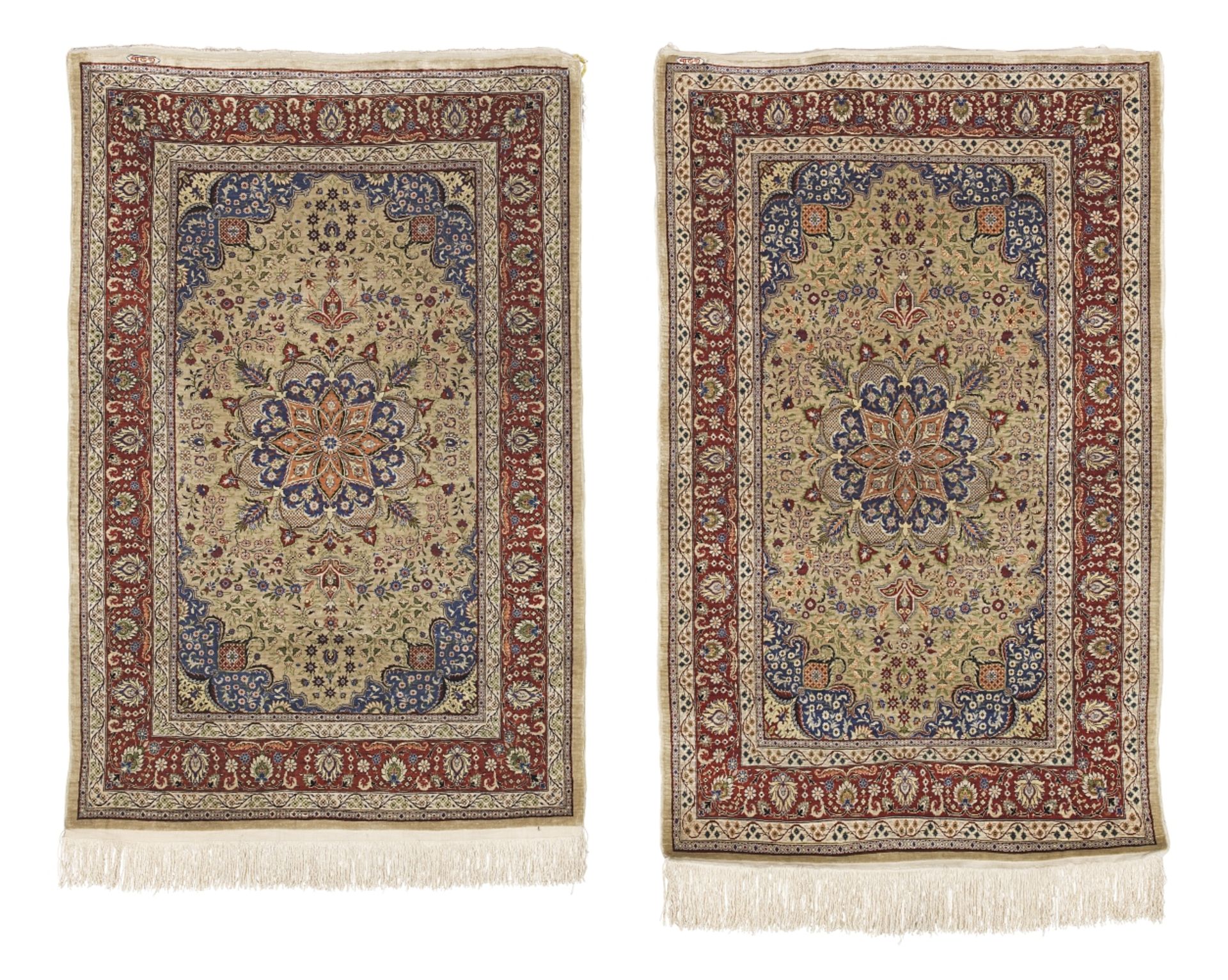 A near pair of signed Hereke silk rugs West Anatolia 130cm x 84cm, 2
