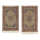 A near pair of signed Hereke silk rugs West Anatolia 130cm x 84cm, 2