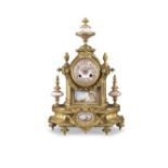 A late 19th century French gilt metal and Sevres style porcelain inset mantel clock in the Louis ...