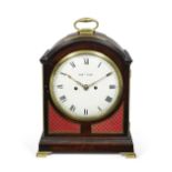An early 19th century brass-mounted mahogany single pad top table clock with trip repeat the dia...