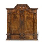 A German 18th century walnut, crossbanded and featherbanded schrank or wardrobe