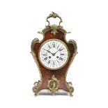 A late 19th century French Boulle mantel clock and a similar period French Tortoiseshell mantel c...