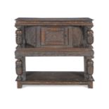 A Charles I oak canted court or 'livery' cupboard1620-1650