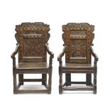 A near pair of 17th century oak panel back armchairsWest Yorkshire (2)