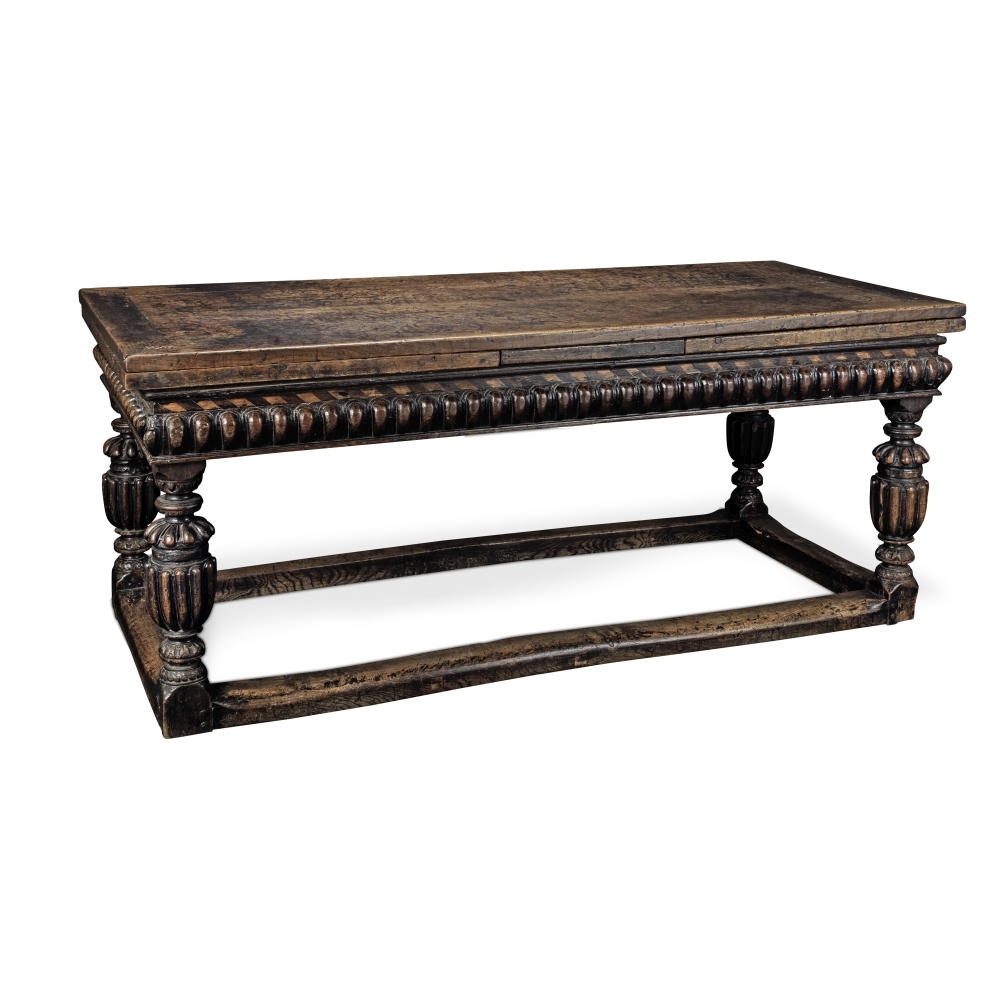 An Elizabethan-style oak draw leaf refectory table