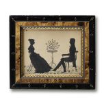 American School (19th Century) A painted silhouette of a man and woman in an interior