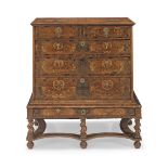 A William and Mary walnut oyster veneered and fruitwood seaweed marquetry chest-on-stand