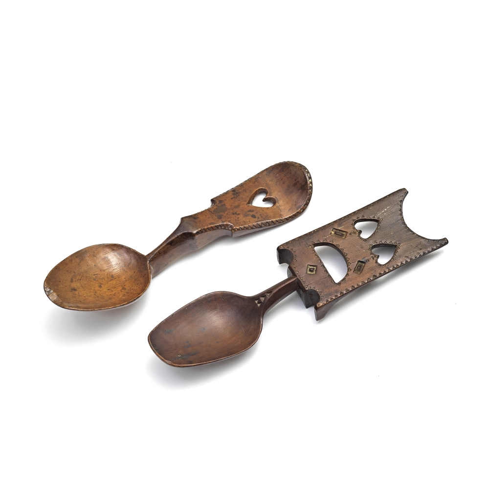 A Welsh 19th century love spoon, together with another (2)