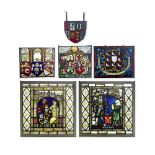 A pair of stained glass panels together with three further stained glass panels (6)