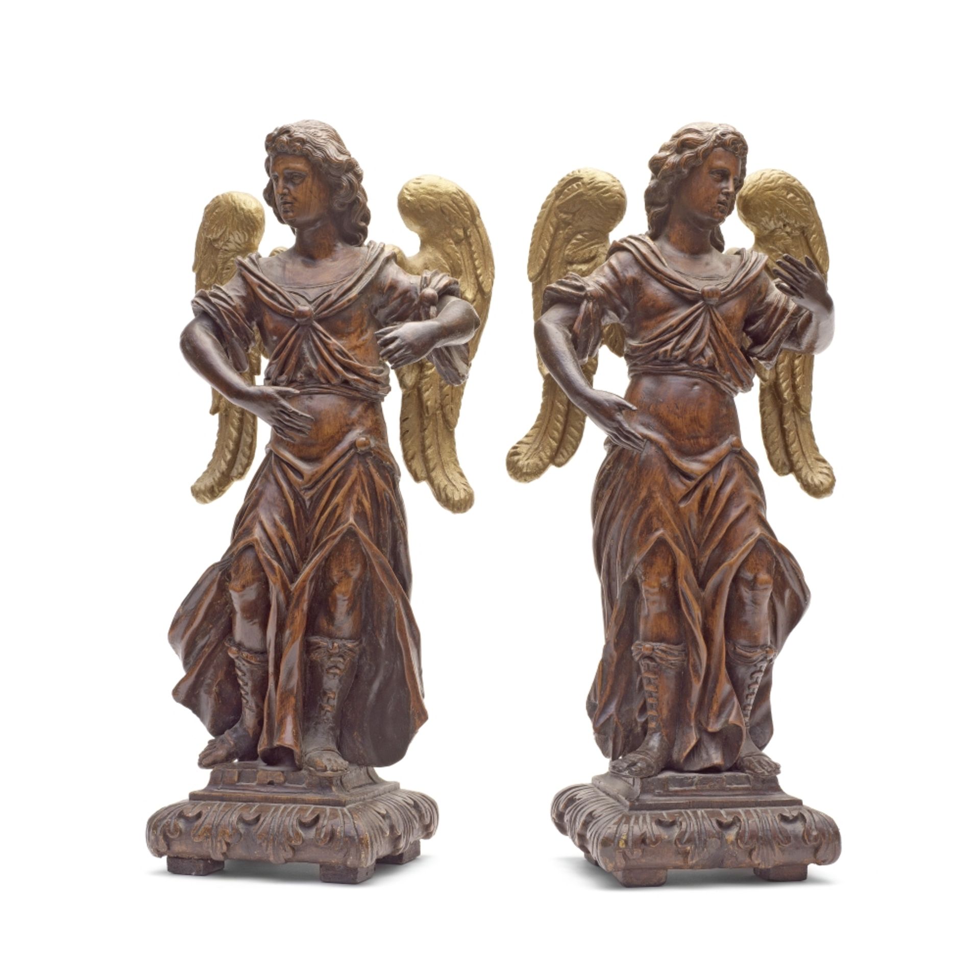 A pair of 18th century carved walnut figures of angels (2)
