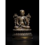 STATUETTE D'UN LAMA EN LAITON INCRUST&#201; D'ARGENT TIBET, XVIE SI&#200;CLE