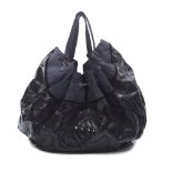 Chanel: a Large Black Drawstring Shoulder Tote 2009-10 (includes serial sticker )