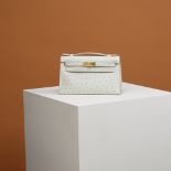 Herm&#232;s: a Gris Perle Ostrich Kelly Pochette 2022 (includes felt protector, dust bag, and box)