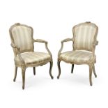 A pair of Louis XV painted and parcel gilt fauteuils