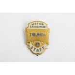 A 1929 Motor exhibition enamel staff badge for Triumph