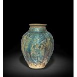 A rare early Raqqa moulded lustre pottery Jar Fatimid Syria, 12th Century