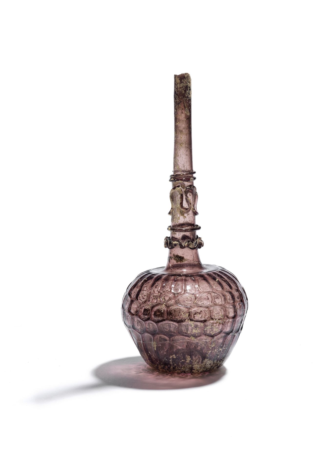 A mould blown glass bottle Persia, late 11th-13th Century