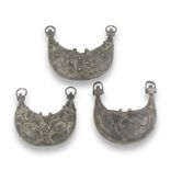 Three Seljuk niello silver-gilt pectoral amulet cases Persia, 12th Century(3)