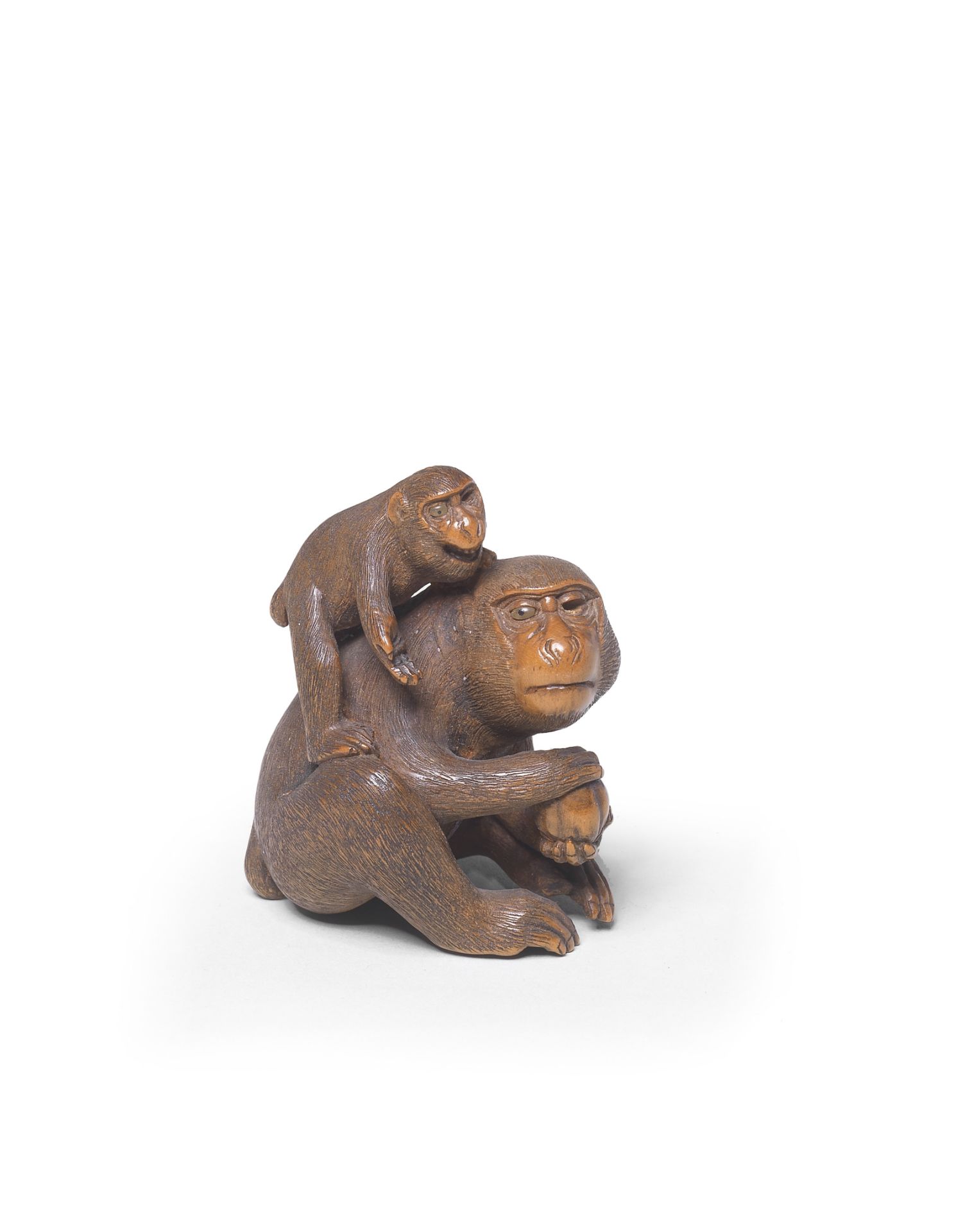 A WOOD NETSUKE OF TWO MONKEYS By Sadakazu, Edo period (1615-1868), 19th century