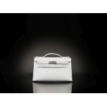 Herm&#232;s: a Blanc Swift Leather Mini Kelly Pochette 2022 (includes felt protector, dust bag, a...