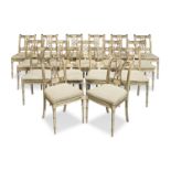 A set of seventeen French painted and parcel gilt dining chairs by Maison Jansen Circa 1938 (17)