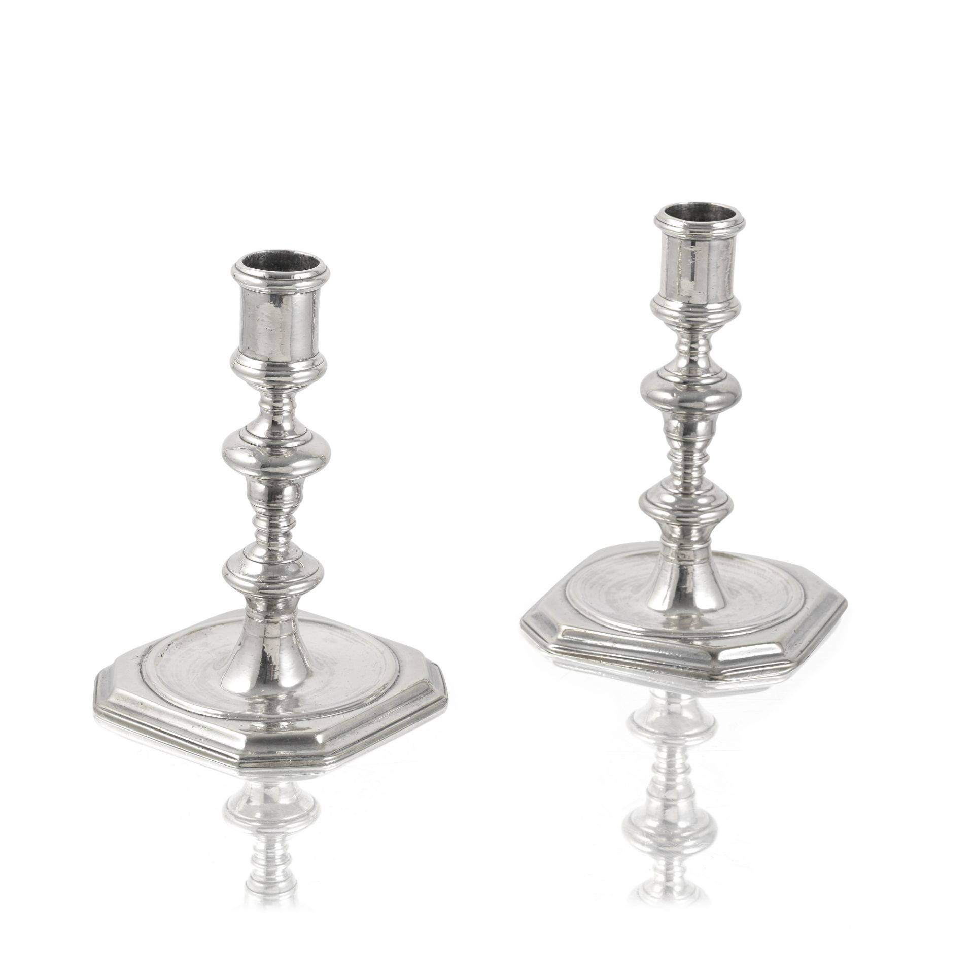 A pair of William III cast silver candlesticks probably Benjamin Braford, London 1695 (2)