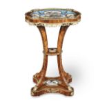 A Napoleon III porcelain and ormolu mounted tulipwood gueridon Circa 1860