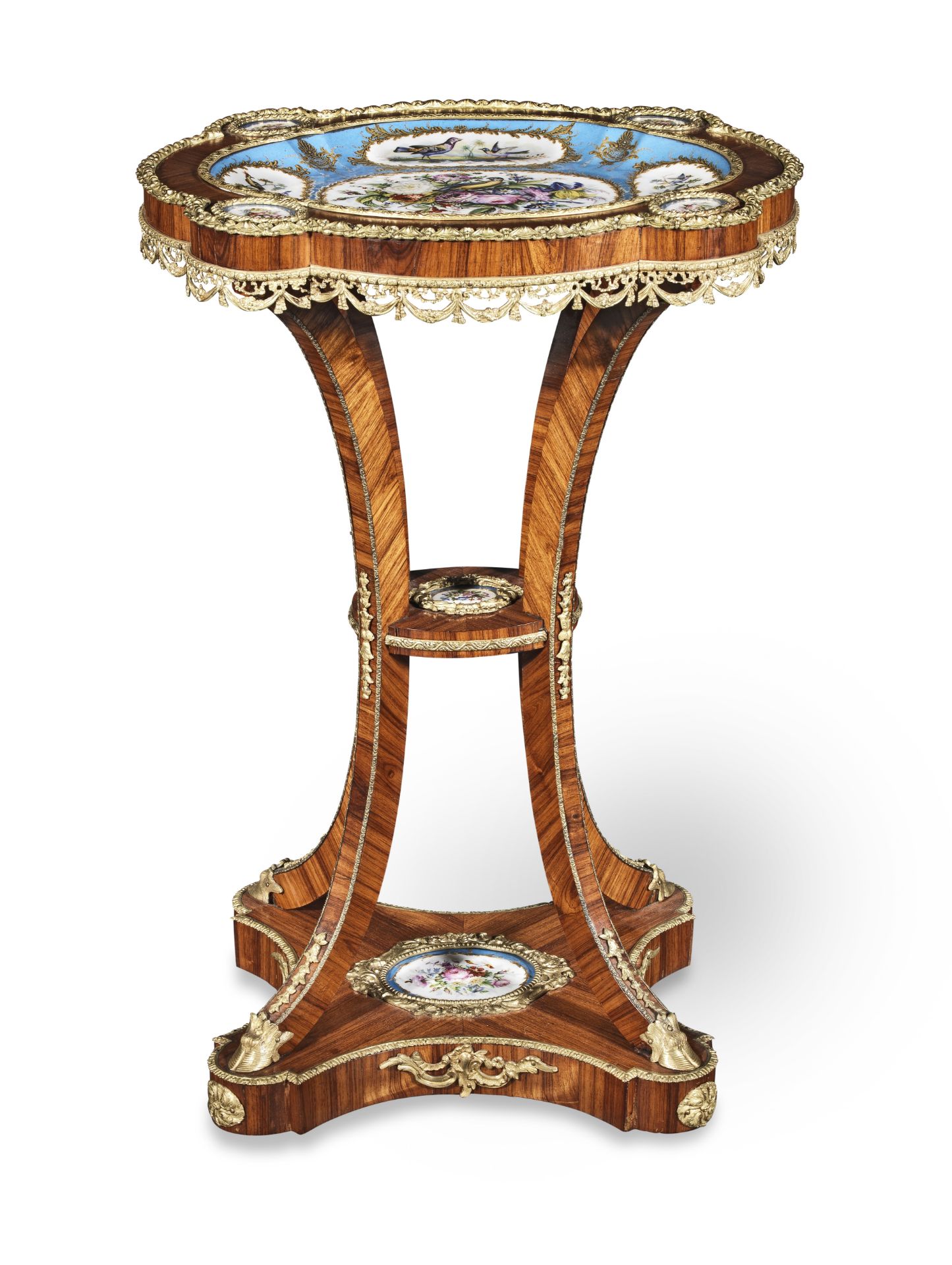 A Napoleon III porcelain and ormolu mounted tulipwood gueridon Circa 1860
