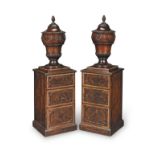 A pair of George III mahogany and kingwood crossbanded urns and pedestals Circa 1780, of Gillows ...