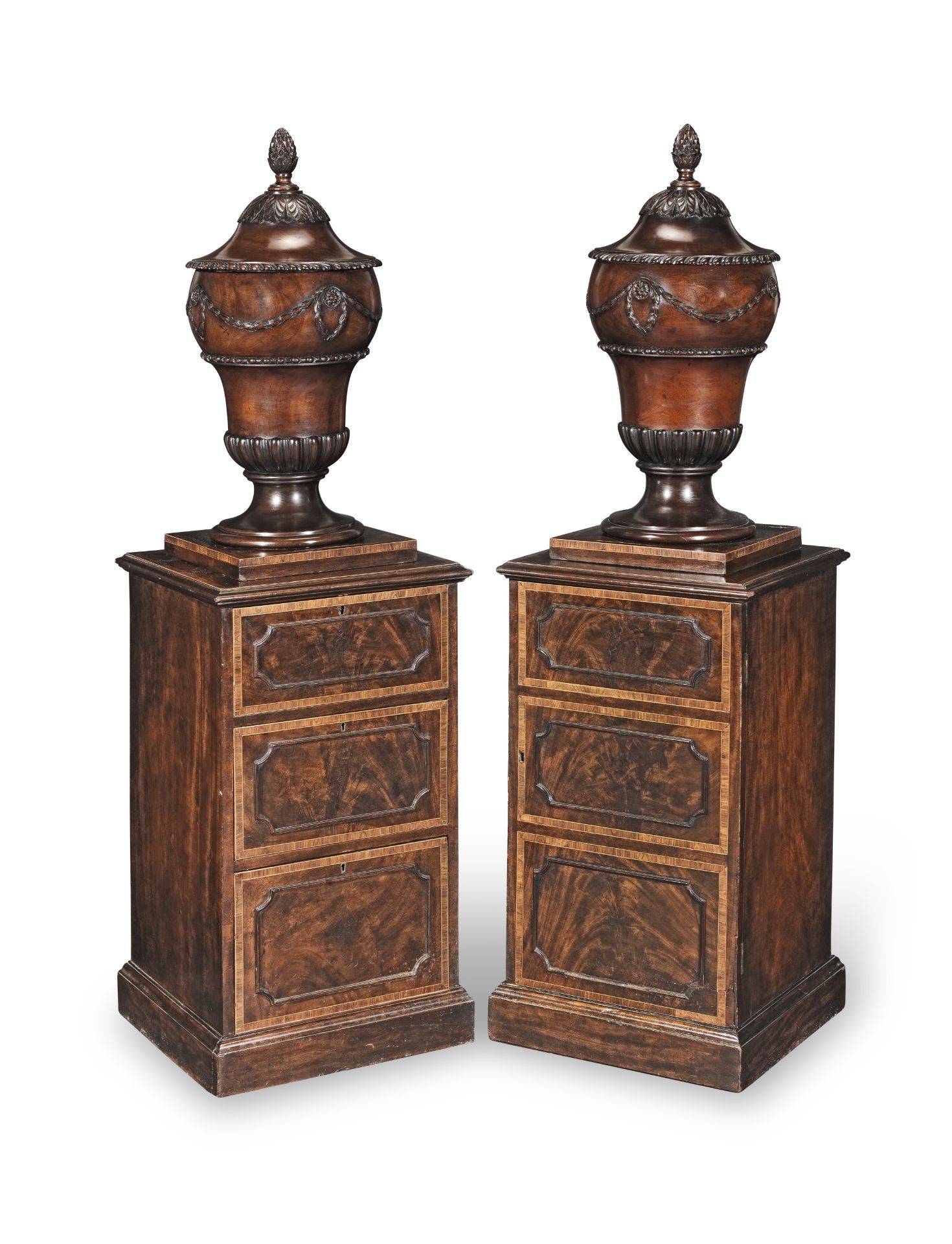 A pair of George III mahogany and kingwood crossbanded urns and pedestals Circa 1780, of Gillows ...