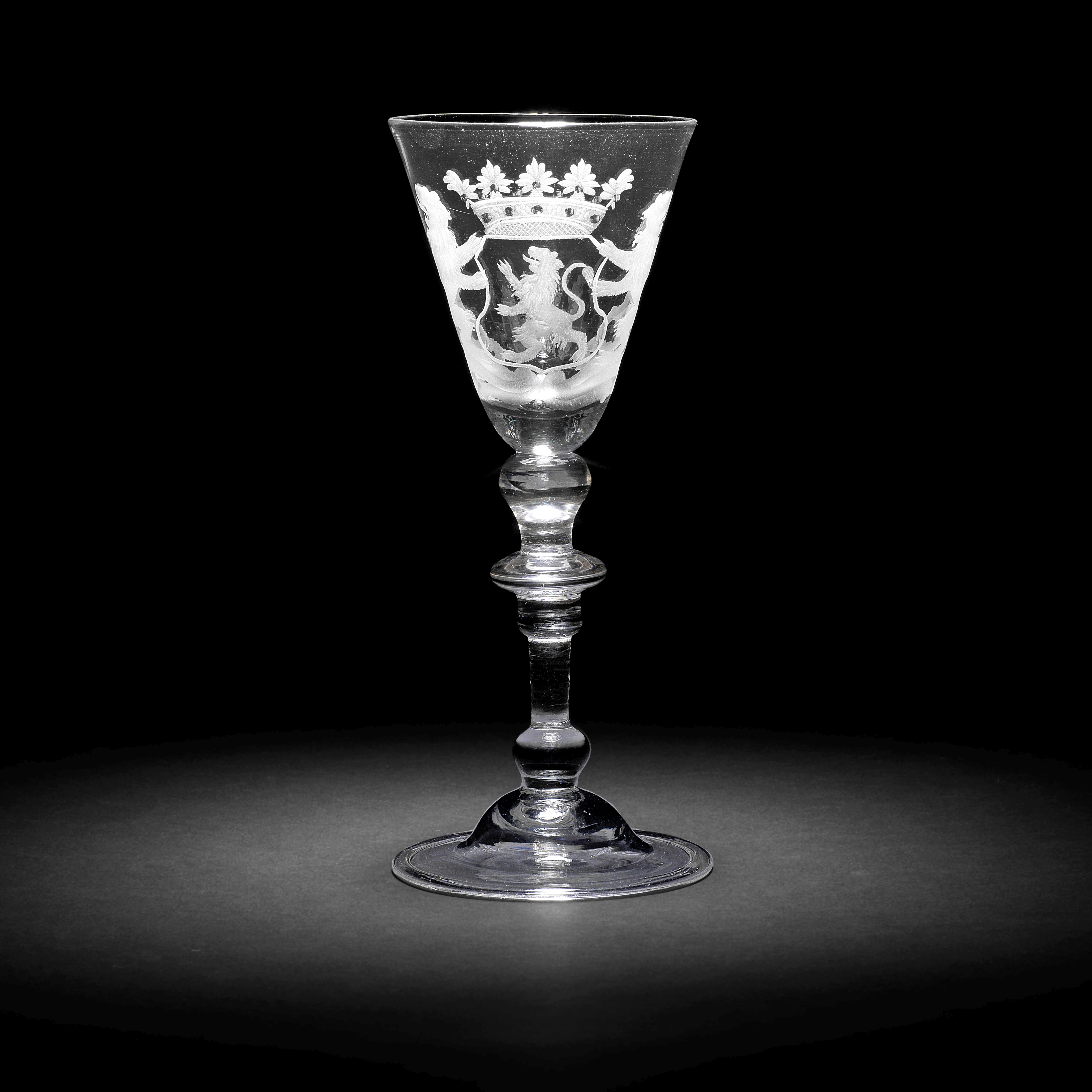 A Dutch engraved armorial light baluster wine glass, circa 1750