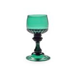 A rare emerald-green baluster mead or champagne glass, circa 1740-60