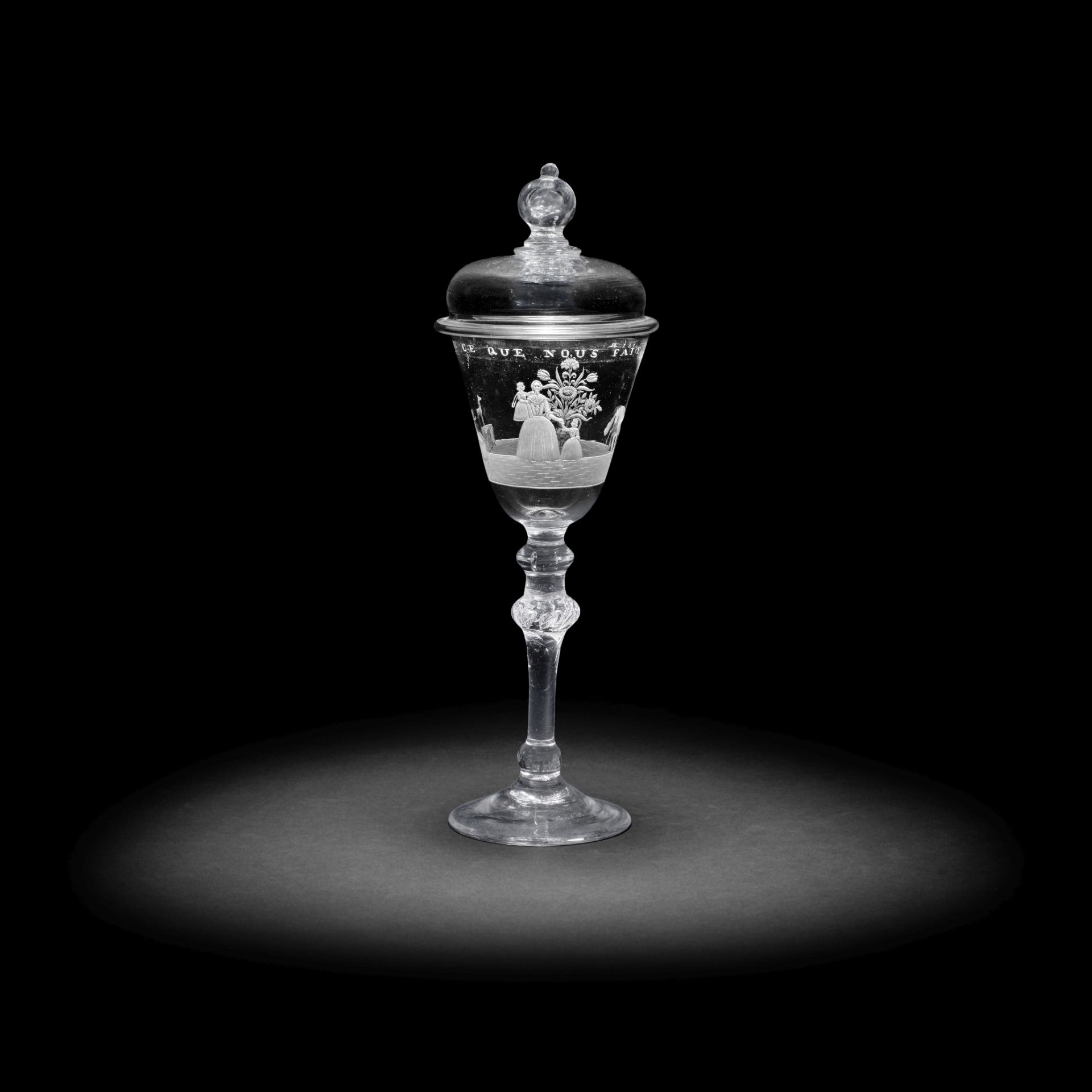 An exceptional Dutch engraved light baluster goblet and cover signed by Jacob Sang, dated 1760