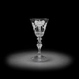 A Dutch engraved armorial light baluster wine glass, circa 1755