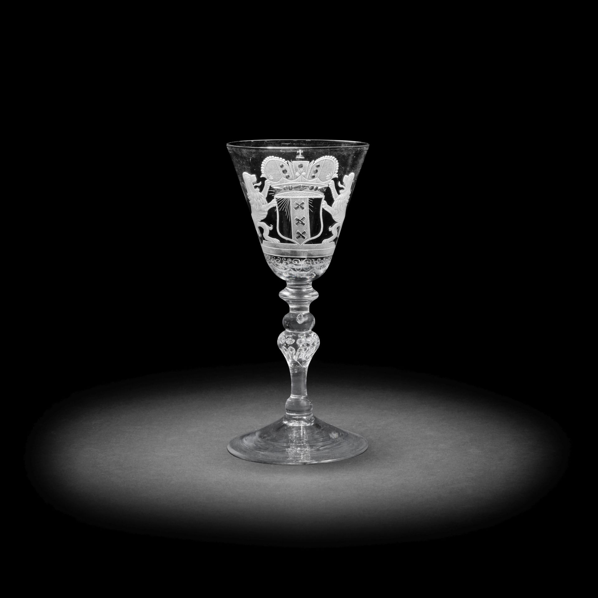 A Dutch engraved armorial light baluster wine glass, circa 1755