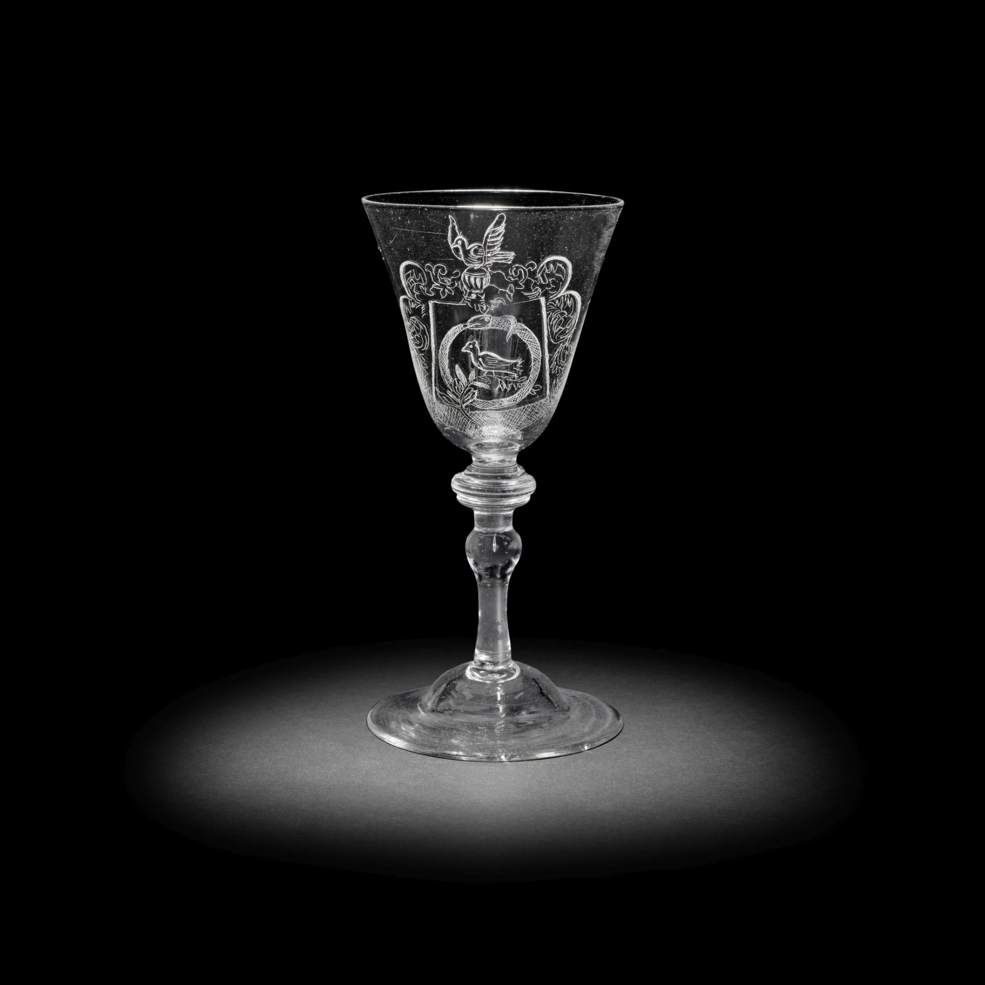 A Dutch engraved armorial light baluster goblet, circa 1750