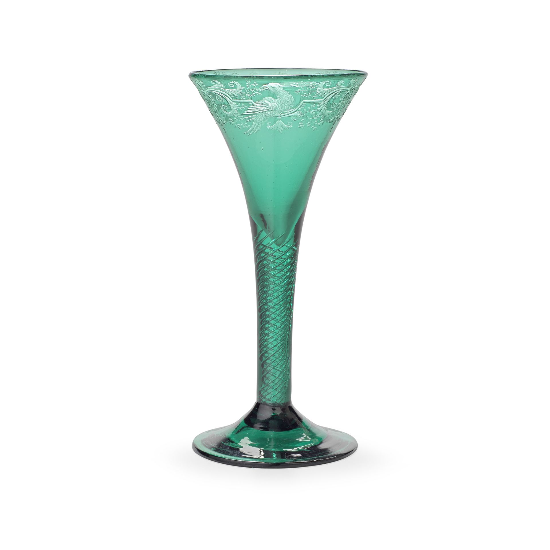 An exceptional emerald-green engraved airtwist wine glass, circa 1750