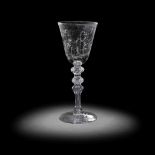 An exceptional Dutch stipple-engraved light baluster goblet by 'Alius', circa 1760-80