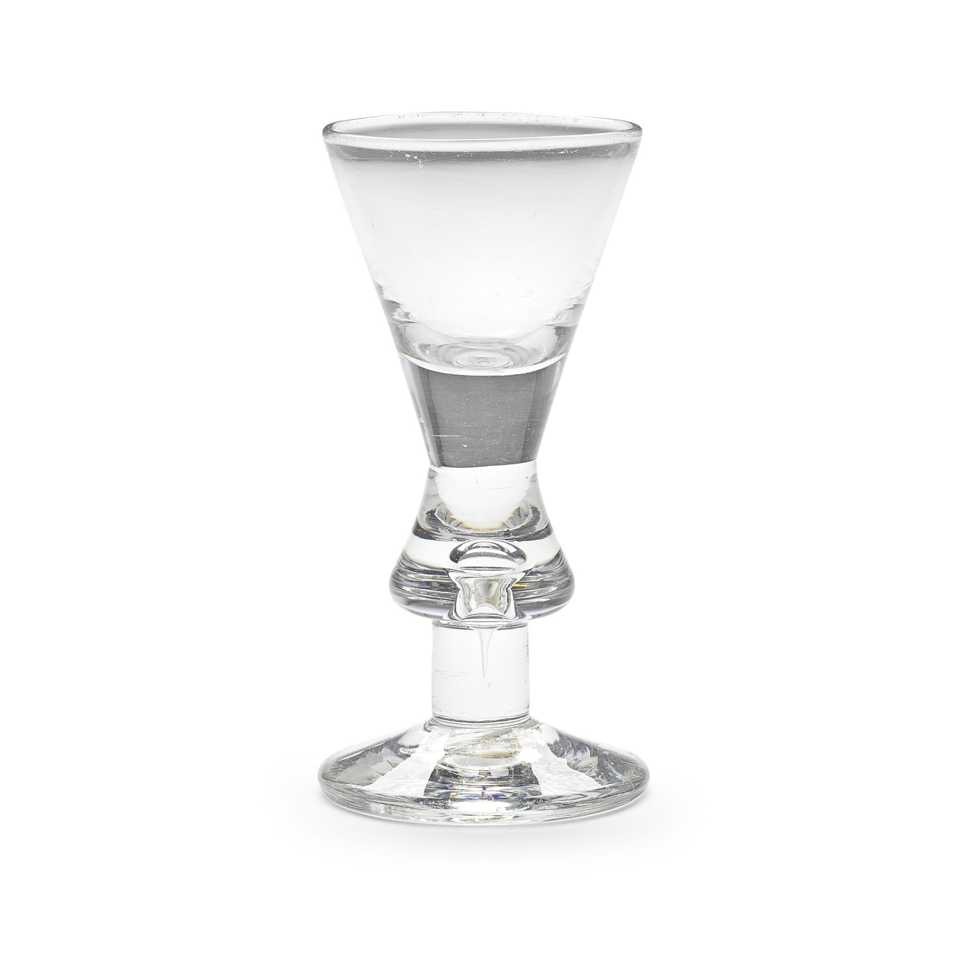 An early heavy baluster wine glass, circa 1700