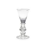 A fine and rare heavy baluster wine glass, circa 1710