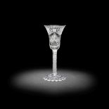 A rare and unusual cut and engraved opaque twist wine glass, circa 1765