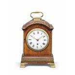 An early 19th century brass-bound single pad top table clock of small size Debois & Wheeler, London