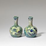 William Moorcroft Pair of 'late florian ware' miniature vases, circa 1920